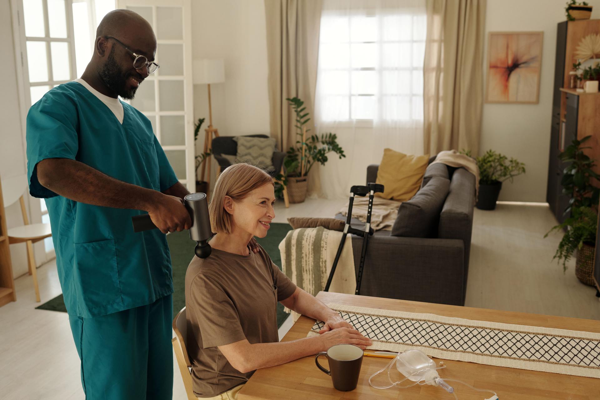 Smiling Elderly Woman Receiving Therapeutic Massage