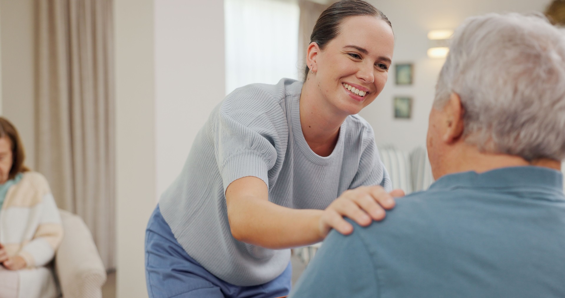 Senior, man and volunteer with support or discussion for rehab, health and compassion in retirement. Elderly, patient and medical caregiver with kindness, sympathy and talking in homecare with advice